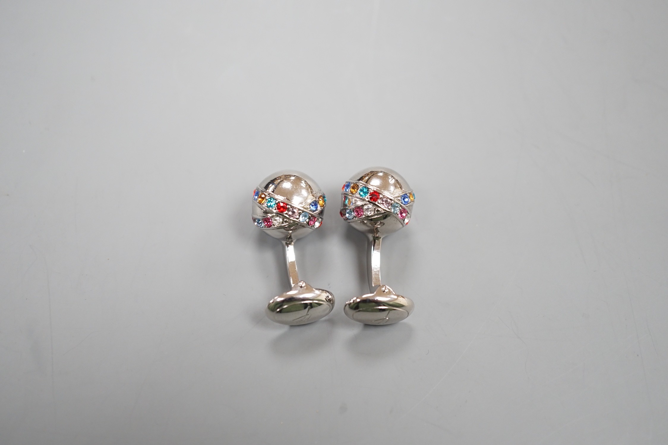 A modern pair of metal and coloured paste set cufflinks.